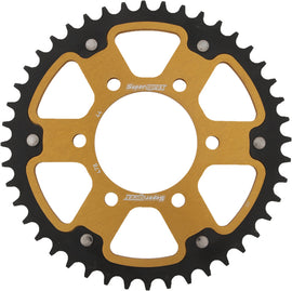 Supersprox rear stealth street motorcycle sprocket 44T aluminum and steel for Kawasaki, gold finish, with visible teeth and mounting holes.