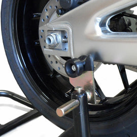 Black Shogun Industries Swingarm Sliders mounted on motorcycle body, showcasing durable protective motorcycle accessories.