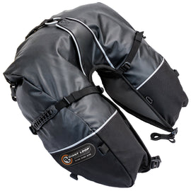 Black Giant Loop Coyote Saddlebag 39L luggage with durable straps and compact design, mounted on a motorcycle for adventure travel.