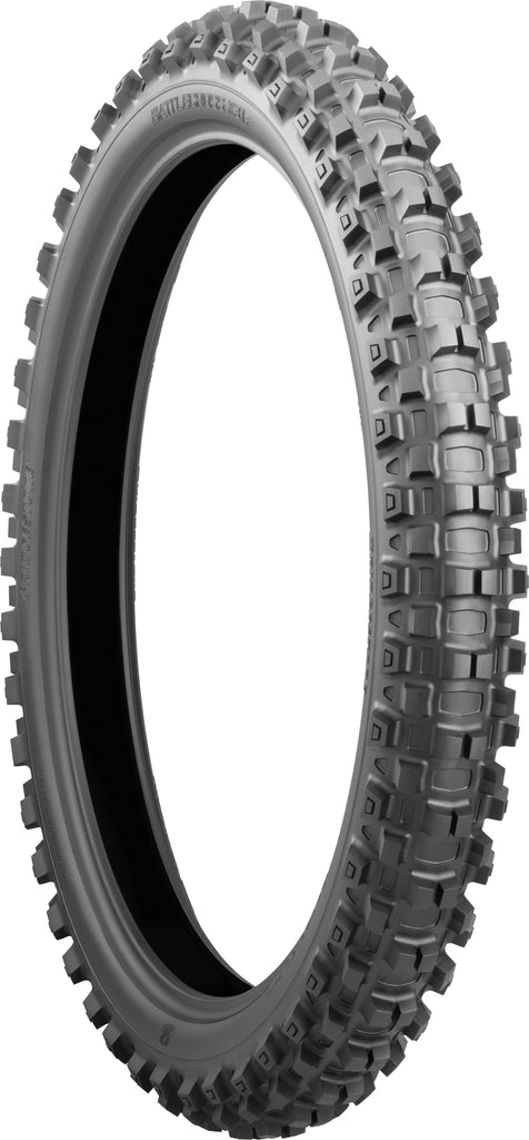 Bridgestone Battlecross X31 front motorcycle tire 90/100-21 bias Tt tread pattern on black rubber with sidewall branding.