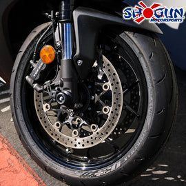 Black Shogun Industries front axle sliders for body protection on motorcycles, model 71-1817, mounted on a vehicle.