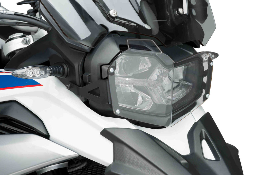 Clear PUIG headlight protector for BMW 561-09762, designed to shield headlights with durable, transparent body protection.