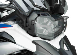 Clear PUIG headlight protector for BMW 561-09762, designed to shield headlights with durable, transparent body protection.