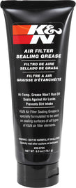 K&N Sealing Grease 6oz container, a black tube with white and red branding, designed for sealing and lubricating automotive parts.