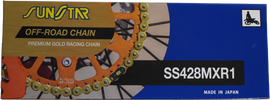 Sunstar MXR1 non-sealed 428x134 gold motorcycle chain showing detailed gold-colored links and branding.