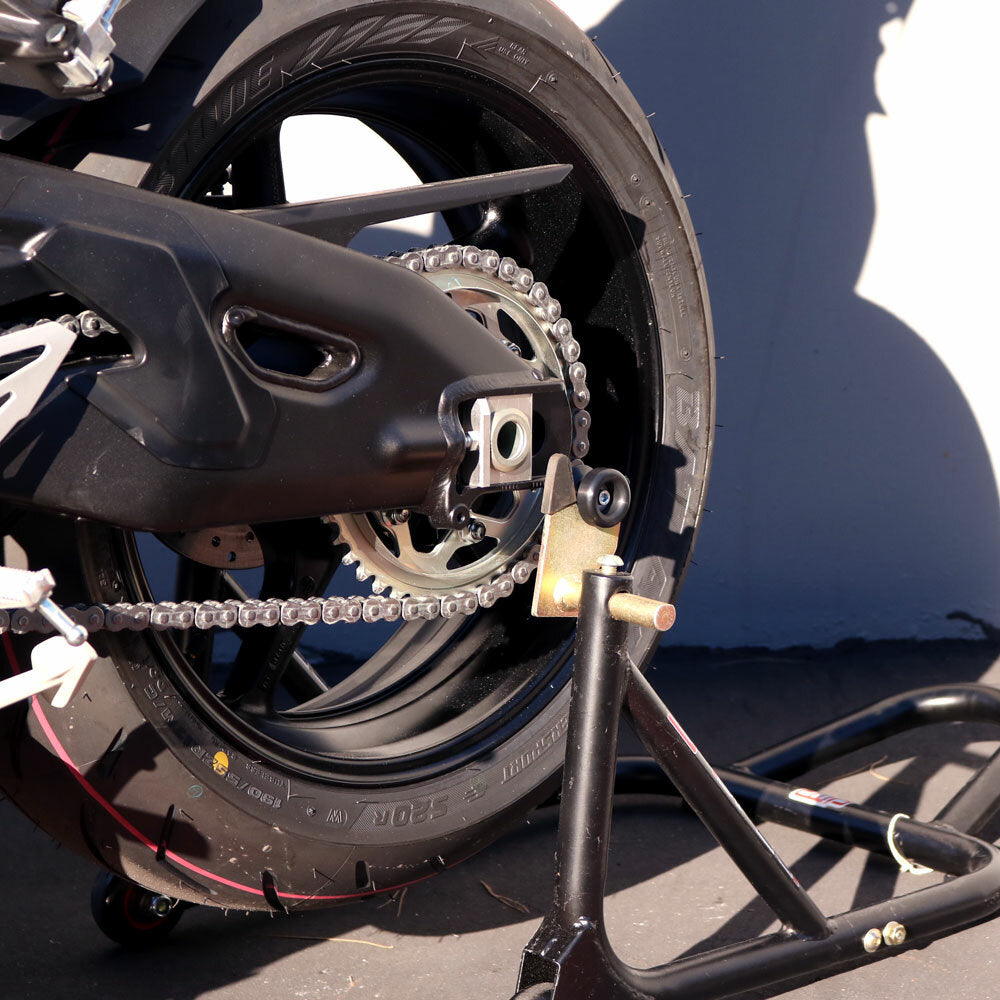 Shogun Industries black swingarm sliders for motorcycle body protection, designed to absorb impact during falls.