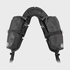 Giant Loop Mojavi Saddlebag 12L in black, mounted on motorcycle, showing durable outdoor luggage with secure straps.