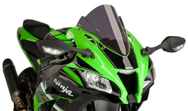 PUIG Racing Dark Smoke Windscreen for motorcycle, tinted windshield with aerodynamic shape and mounting hardware visible.