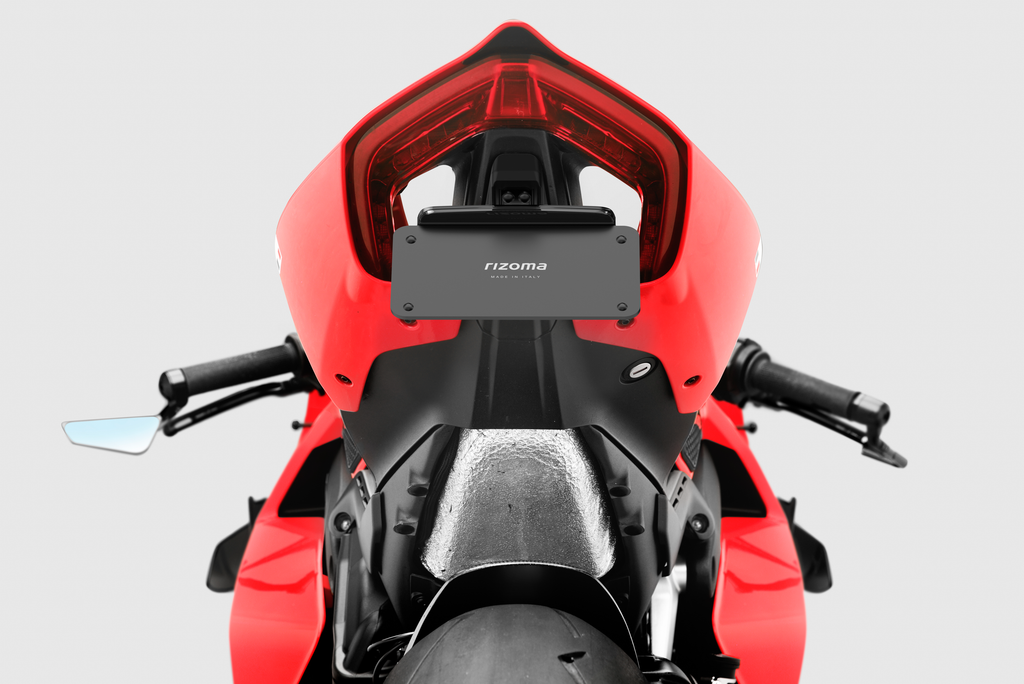 RIZOMA Flat-Out Fender Eliminator kit for Ducati 58-PTU010B, close-up of sleek black motorcycle body part and mounting hardware.