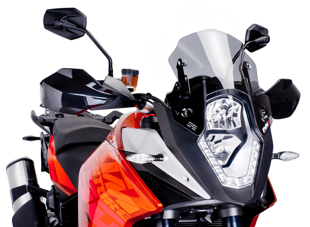 PUIG Racing Light Windscreen for motorcycle, clear windshield with aerodynamic design, mounted on bike with mounting brackets.