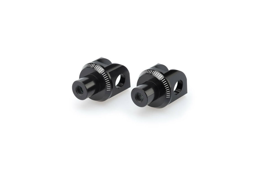 PUIG footpeg adapter for motorcycle foot controls, black metal part with mounting hardware visible in the image.