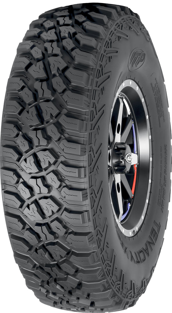 ITP Tire Tenacity Xnr 32x10R15 off-road tire with rugged tread pattern for ATV and UTV vehicles.