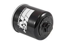 Load image into Gallery viewer, K&amp;N Oil Filter 56-0183 showing the cylindrical filter with metal mesh exterior and printed branding in a close-up view.