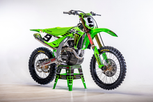 Load image into Gallery viewer, DCOR Kawasaki graphic kit with decals featuring bold black and green designs for motorcycle customization.