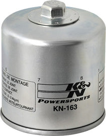 K&N Oil Filter 56-0163 showing a new, black cylindrical oil filter with metal end caps and threaded center for engine oil filtration.