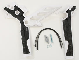 Acerbis X-Grip frame guard in white and black mounted on motorcycle frame, showcasing durable protective design.
