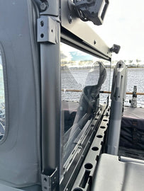 Kolpin rear windshield panel in black, designed for utility vehicles, with a smooth surface and mounting edges visible.