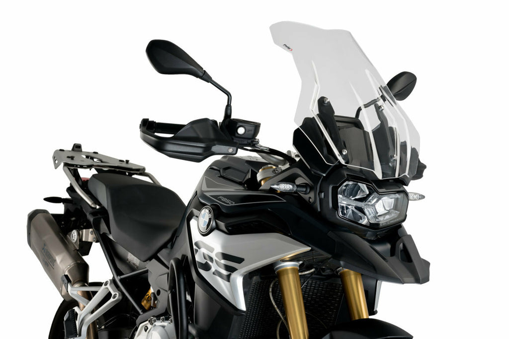 Clear PUIG touring windshield for BMW motorcycle, showcasing the curved, transparent windscreen designed for rider protection.
