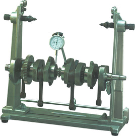 K&L Mc310 3-in-1 truing stand for bicycle wheels, showing adjustable arms, clamps, and measurement dials in a workshop setting.