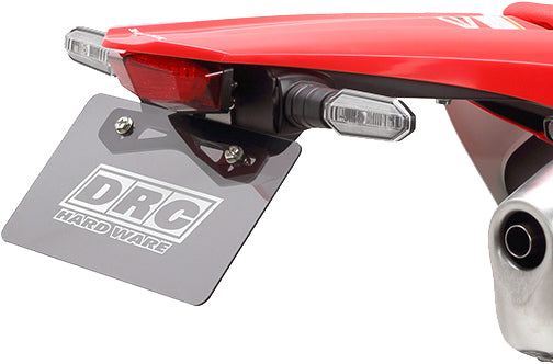 DRC Edge taillight holder kit with red lens for motorcycle illumination, showcasing mounting brackets and lens details.