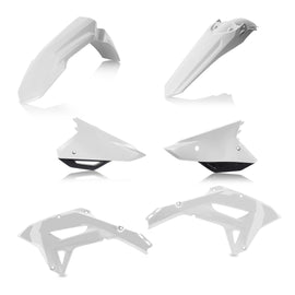 Acerbis plastic kit in white and black, featuring various durable motorcycle body panels and components on a flat surface.