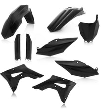 Load image into Gallery viewer, Acerbis full plastic kit in black with various bike panels and parts, displayed on a workbench for motorcycle customization.