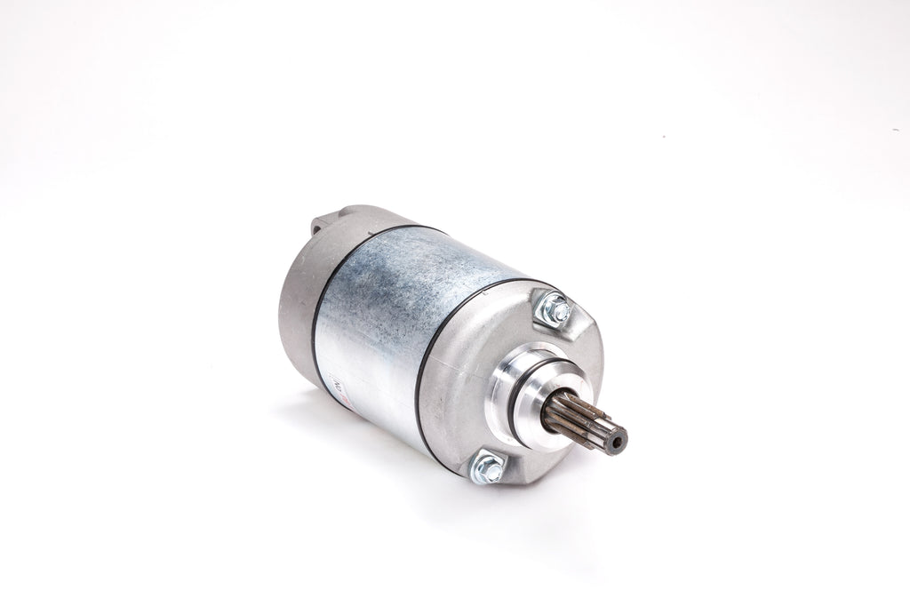 Ricks Motorsport Electric starter motor for motorcycle, showing the compact metal device with wiring and mounting points.