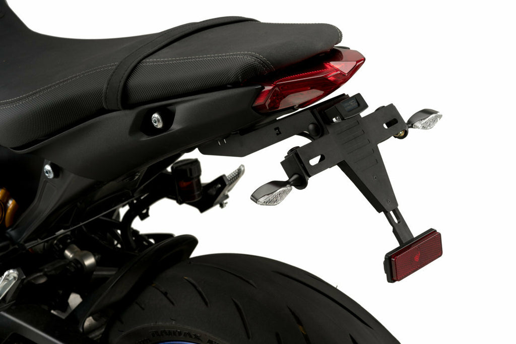 Black PUIG Fender Eliminator Kit for Yamaha motorcycles, close-up view of the sleek body component with mounting hardware.
