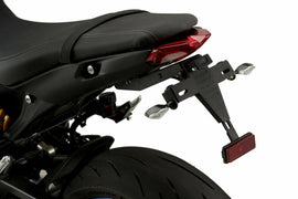 Black PUIG Fender Eliminator Kit for Yamaha motorcycles, close-up view of the sleek body component with mounting hardware.