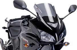 PUIG Racing Dark Smoke Windscreen for motorcycle windshield, featuring sleek dark tinted design and aerodynamic shape.