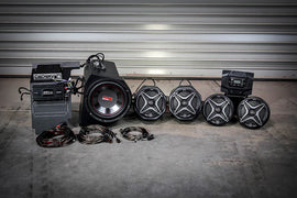 SSV Works SSV 5 Speaker Kit for Polaris General, mounted with speakers and wiring in an off-road vehicle interior.