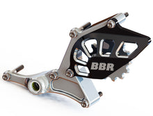 Load image into Gallery viewer, BBR shift shaft brace guard for Honda CRF110 motorcycle, showing durable metal construction and mounting points.