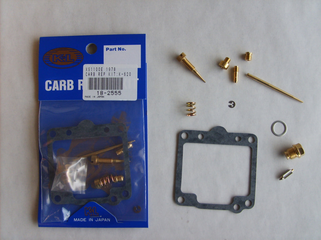 K&L Carburetor Repair Kit 118-2555 for intake, carburetor, and fuel system with assorted gaskets and components laid out.