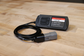 Dynojet Research Power Vision 3 S/D engine management device with display screen and control buttons for motorcycle tuning.