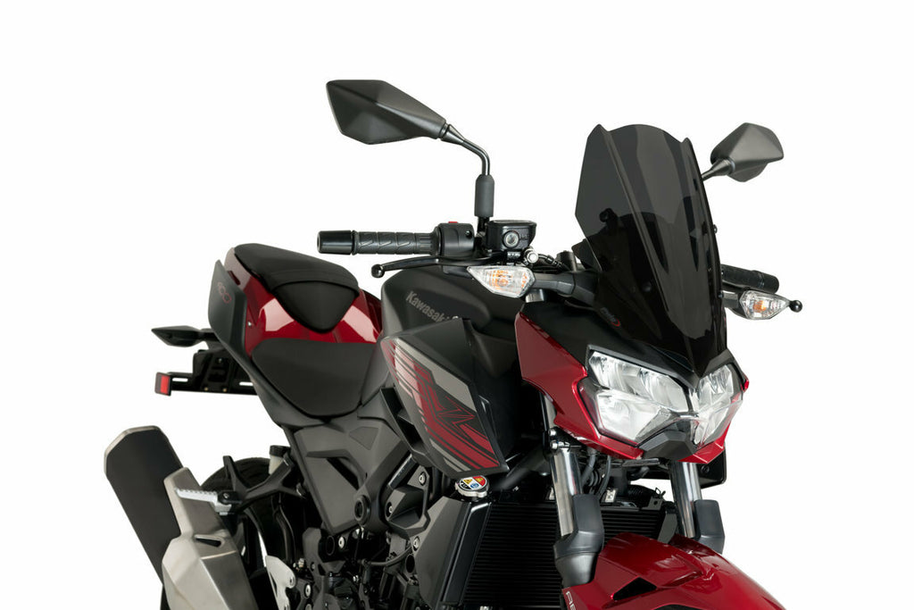 PUIG Naked New Gen Dark Smoke motorcycle windscreen on Kawasaki bike, showing tinted, aerodynamic design with mounting edges.