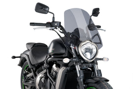 PUIG naked new generation touring smoke windshield for Kawasaki motorcycle, featuring sleek, tinted design for rider protection.