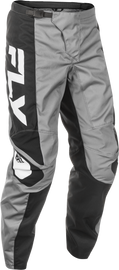 Fly Racing F-16 riding pants in grey, black, and white with size 40, featuring durable fabric and motorcycle gear design.