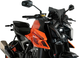 PUIG Naked New Gen Sport dark smoke windshield for KTM motorcycle, showcasing sleek, tinted windscreen design.