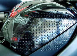 Stompgrip Tank Pad Kit Volcano Black for motorcycle body protects and enhances grip, shown on black tank surface.