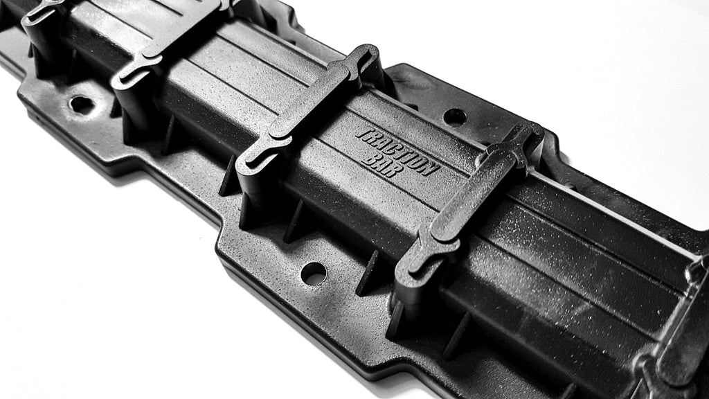 Super Clamp traction bar kit with mounting brackets and hardware, featuring six durable clamps for secure installation.