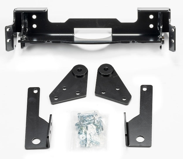 Warn front plow mounting kit with brackets and hardware, designed for secure installation on compatible vehicles.