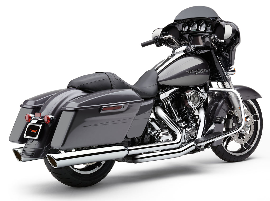 Cobra 909-Twins 4-inch chrome slip-on exhaust for Harley FLH/Flt 95-16 motorcycles, shown installed on bike.