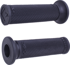 Black ODI Grips Ruffian Slip-On grips with textured surface for motorcycle handlebars, shown on a bike handlebar.