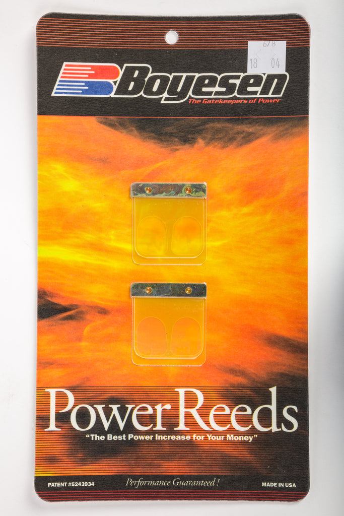 Boyesen motorcycle intake/reed system with high-performance reeds, part number 59-7678, installed on a bike engine.