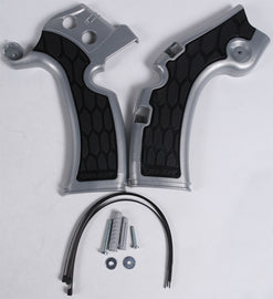 Acerbis X-Grip Frame Guard in silver and black attached to motorcycle frame for protection and style.