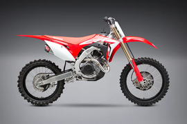 Yoshimura RS-9T exhaust header and canister with end cap, dual system, stainless steel, aluminum, and carbon fiber finish.