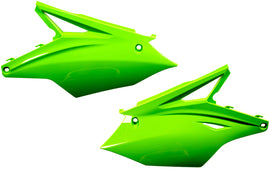 Green Acerbis side panels for motorcycles, featuring durable plastic construction and brand logo details.