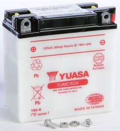 Yuasa YB9-B conventional car battery showing top view with terminals and label, suitable for automotive use.