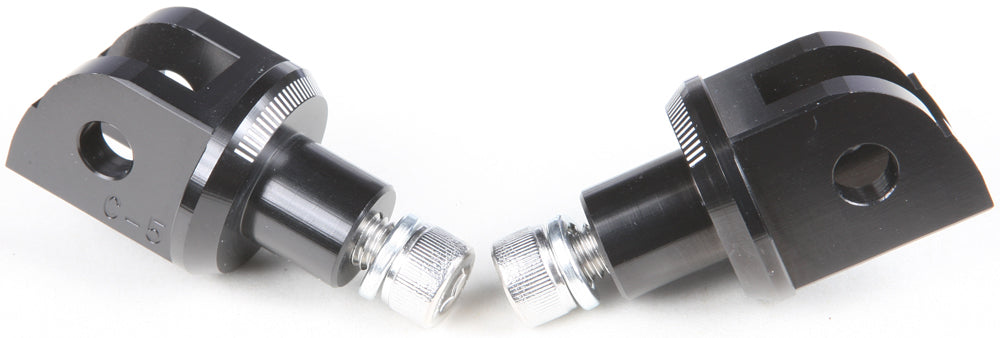 PUIG Footpeg Adapter 561-06453BK for motorcycle foot controls, showing black metal mounting component on a motorcycle.