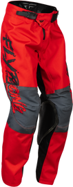 Fly Racing Youth Kinetic Khaos Pants in black, red, and grey, size 24, featuring durable motocross gear design.